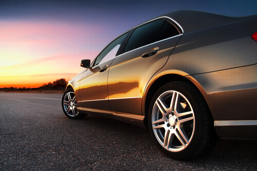 Canadian car on the open road at sunset